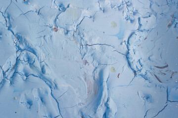 Dry blue oil paint cracks and crevices texture for background