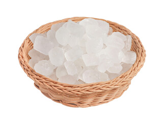 Fototapeta na wymiar Rock sugar in a wicker basket on a white background.