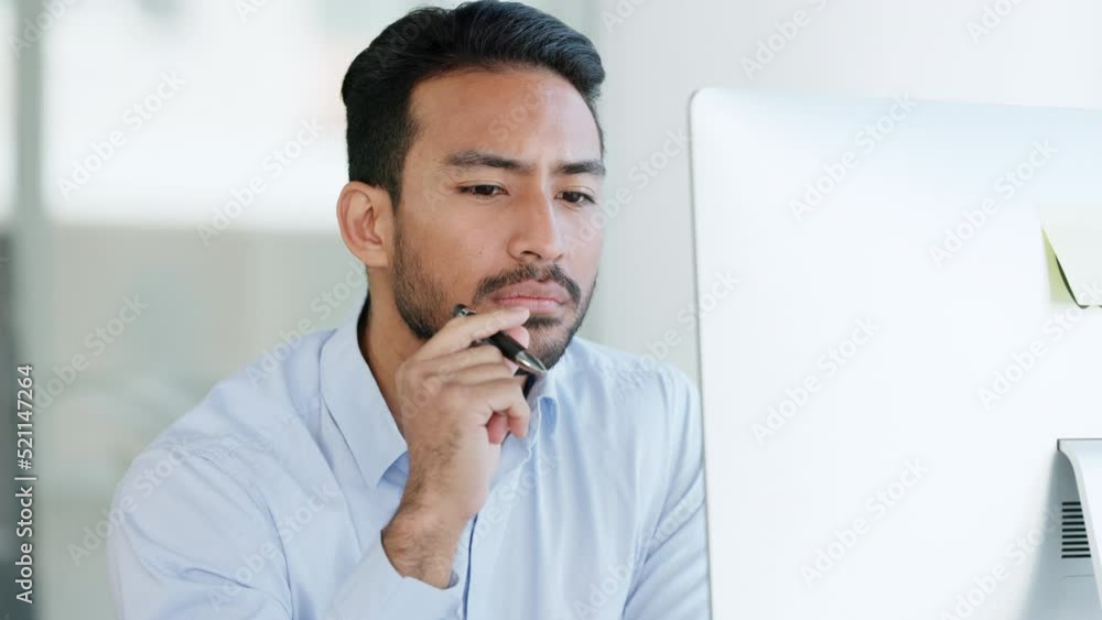 Poster Serious and thinking IT businessman looking at desktop computer writing, working or brainstorming strategy. Smart and intelligent tech manager looking for new solution or ideas for corporate software