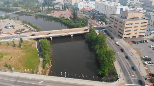 4K Drone Video of the Cushman Street Bridge over the Chena River in Downtown Fairbanks, Alaska during Summer Day