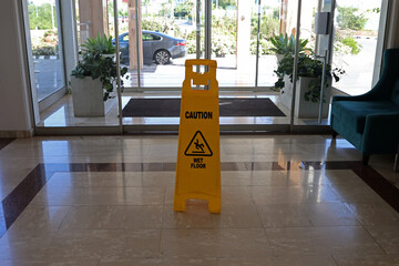 Danger of slipping on a wet floor while cleaning