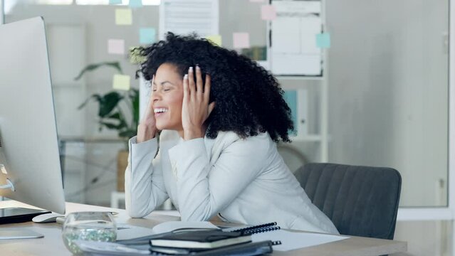 Excited, celebrating and cheering for success with a corporate, professional and modern business woman. Happy, smiling and winning female executive working on a computer at her desk in the office