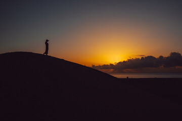 Fototapeta na wymiar Sunset on the women's beach