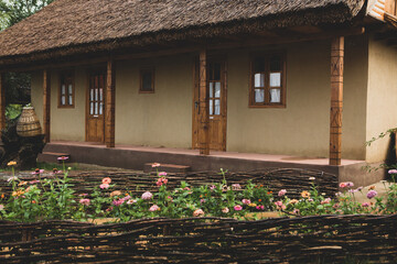 Rural house made of clay and clay roof. The ideal country house for rest and relaxation in the bosom of nature