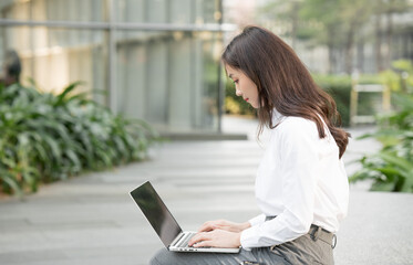 Asian business women working outdoors