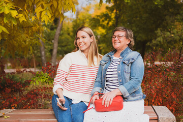 woman, family, mom, daughter, fall, autumn, fall leaves, mother and daughter, walk, love, park, casual, yellow, portrait, female beauty, having fun, happy, people, person, women, happiness, fun, relax
