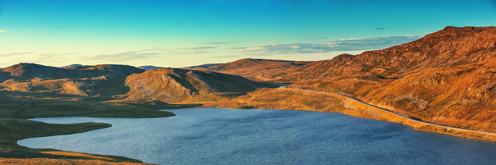 Beautiful mountain lake in the evening. Northern Norway. Horizontal banner