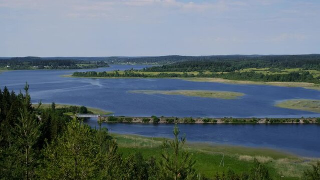 Russia, Republic Karelia. View from Mount Paasonvuori in Sortavala to lake and fields. Popular tourist destination. Mount Paaso, observation deck overlooking river and surrounding area in summer.