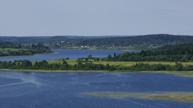 Russia, Republic Karelia. View from Mount Paasonvuori in Sortavala to lake and fields. Popular tourist destination. Mount Paaso, observation deck overlooking river and surrounding area in summer.