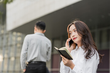 Asian business men and women working partners outdoors