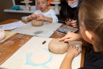 creative workshop on Halloween day on pumpkin modeling from clay.