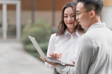 Asian business men and women working partners outdoors