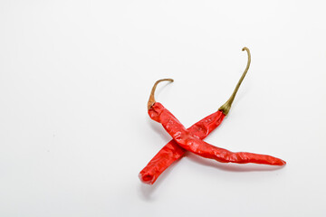 Dried red chili or chilli cayenne pepper isolated on white background cutout. is spicy than fresh...