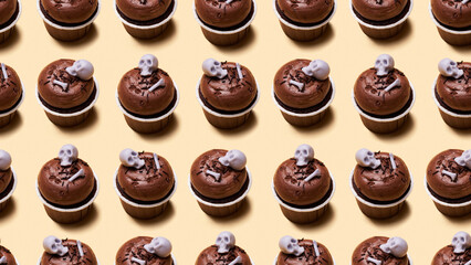 Seamless pattern of Halloween treat maffin decorated skeletons.