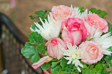Close up view of a beautiful bouquet of mixed coloful flowers . The concept of a flower shop and flower delivery as a family business, florist work.