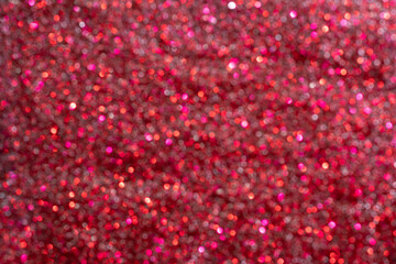 Red glitter out of focus nail polish texture. Celebration holiday background