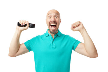 Caucasian adult  man holding a tv  remove controller raising fist after a victory.  Winner concept.