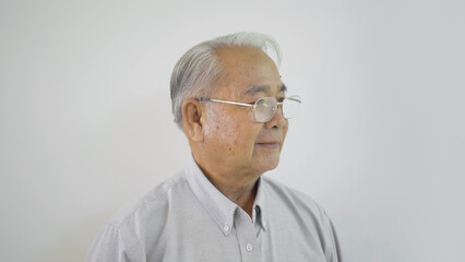 Portrait of happy smiling senior old elderly business Asian man person standing isolated on white background.