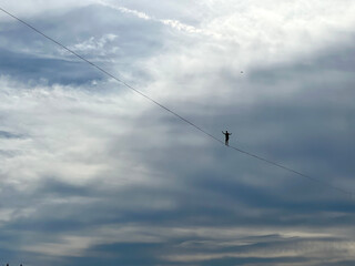 French tightrope walker Nathan Paulin walks on a 950 meters long slackline, 50 meters over Geneva...