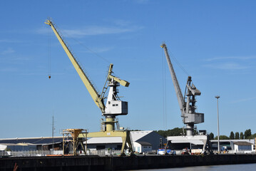 Fototapeta na wymiar Two cranes port of Saint Nazaire. Estuary of the Loire river, France. 