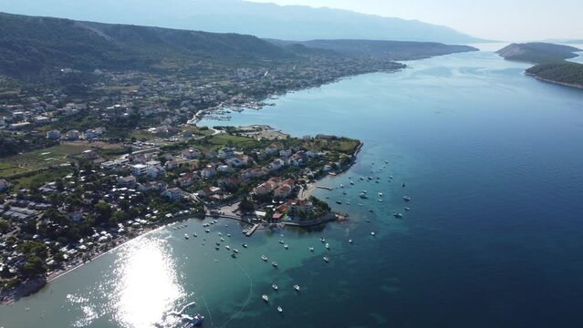 city of Rab, Croatia filmed by a drone, 150 meters above the sea, summer, early morning