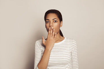 Portrait of attractive shocked woman on white background