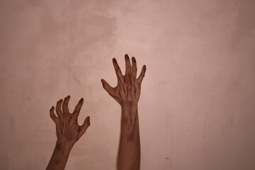 Halloween horror concept. Image of creepy ghost hand with black nails, isolated on background
