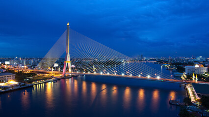 Fototapeta na wymiar The Bridge across the river at dusk, Rama VIII bridge (Bangkok, Thailand)