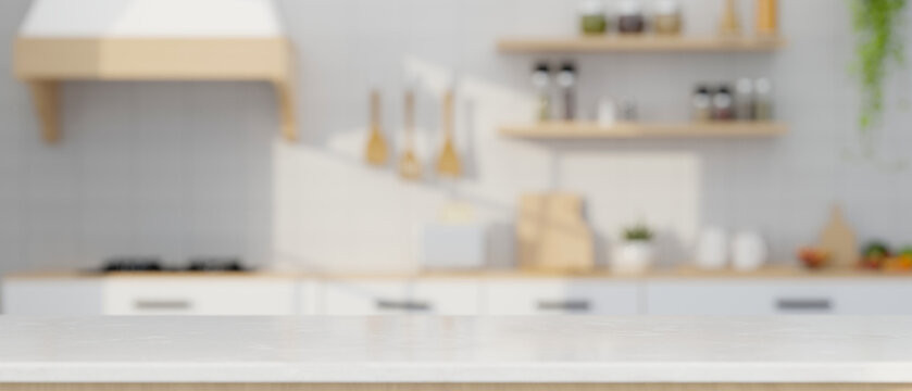 Empty mockup space over blurred modern minimal white kitchen cooking space in background.