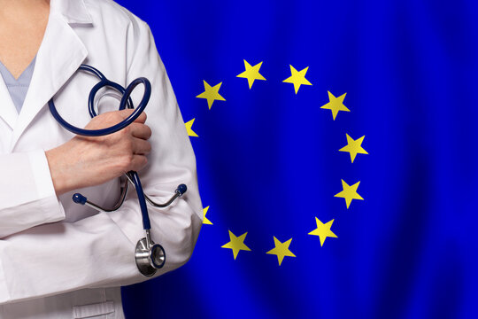 EU medicine and healthcare concept. Doctor close up against flag of European Union background