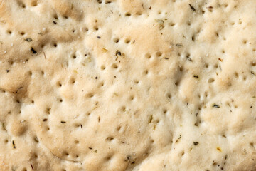 Italian focaccia with rosemary background. Close up