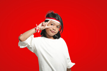 isolated girl wearing red and white ribbon celebrating Indonesian independence in cool style.