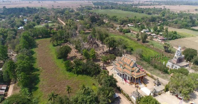 Aerial shot of Ek Phnom Temple, Pagoda and Buddha statue