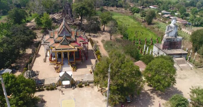Aerial shot of Ek Phnom Temple, Pagoda and Buddha statue