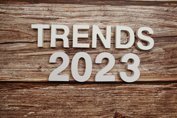 Trends 2023 alphabet letters on wooden background