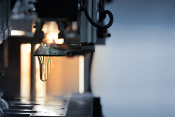 PET Preform in PET bottles blow molding machine in factory, Technology in plastic bottles machine for industry, Industrial and factory concept