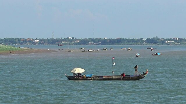 Fishing boat drifting slowly on the Mekong river