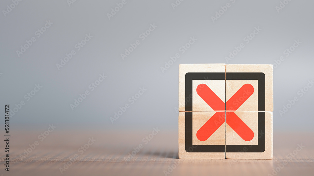 Fototapete red cross mark, x, wrong mark sign, rejection sign in wooden cube stack. concept of negative decisio