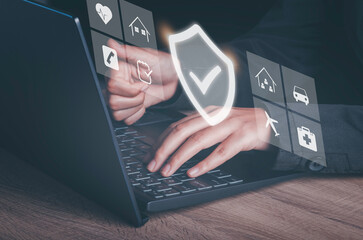 Insurance online digital technology concept. Hand using labtop buy family, car, health and travel Insurance Policy Protection icon on virtual screen , Accident Claim Risk Defense.