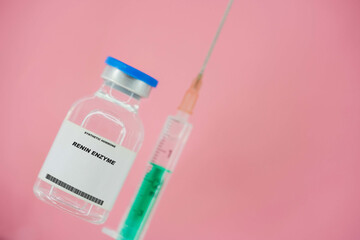 Renin enzyme. Test tube with artificial hormone on pink background Renin enzyme