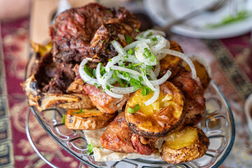 Pork and potatoes cooked in traditional Turkish and Caucasian tandoor.
