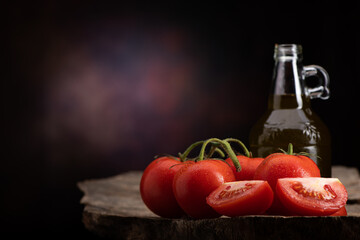 Fresh Tomato and olive oil on the wooden table