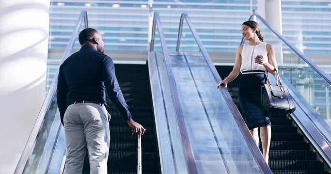 Traveling Professional Business People At The Airport Greeting, Holding A Suitcase And Taking A Trip To A Conference. Corporate Executive Coming Down An Escalator With Luggage On The Way A Convention