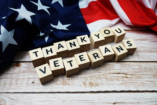 Thank You Veterans alphabet letter on wooden background