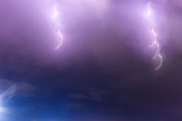 lightning flashes in the night sky