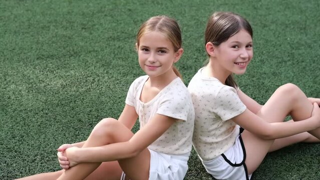 sisterhood. two sisters or friends spending time outdoors on sunny summer day. bff, sibling, girlfriend. millennial teen.