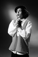 Obraz premium Portrait of beautiful emotive woman in stylish classical clothes, showing emotions of shock and empathy. Black and white photography