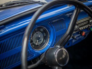 Dashboard and steering wheel of old-timer car