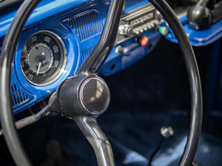 Dashboard and steering wheel of old-timer car