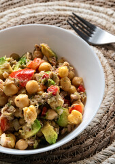 Fresh chickpea salad with tuna, tomato, pepper, onion and avocado
